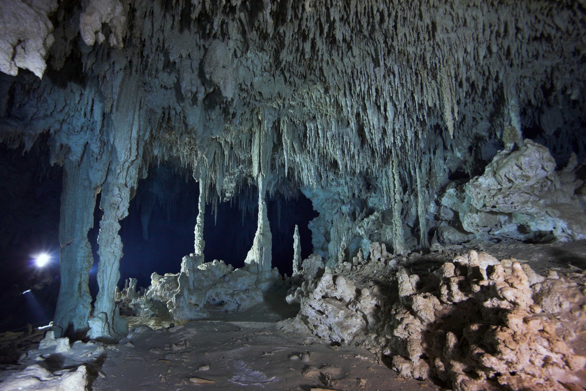 Stalactites and stalagmites in the large cavern of the Toh Ha cave system Stalactites and stalagmites in the large cavern of the Toh Ha cave system